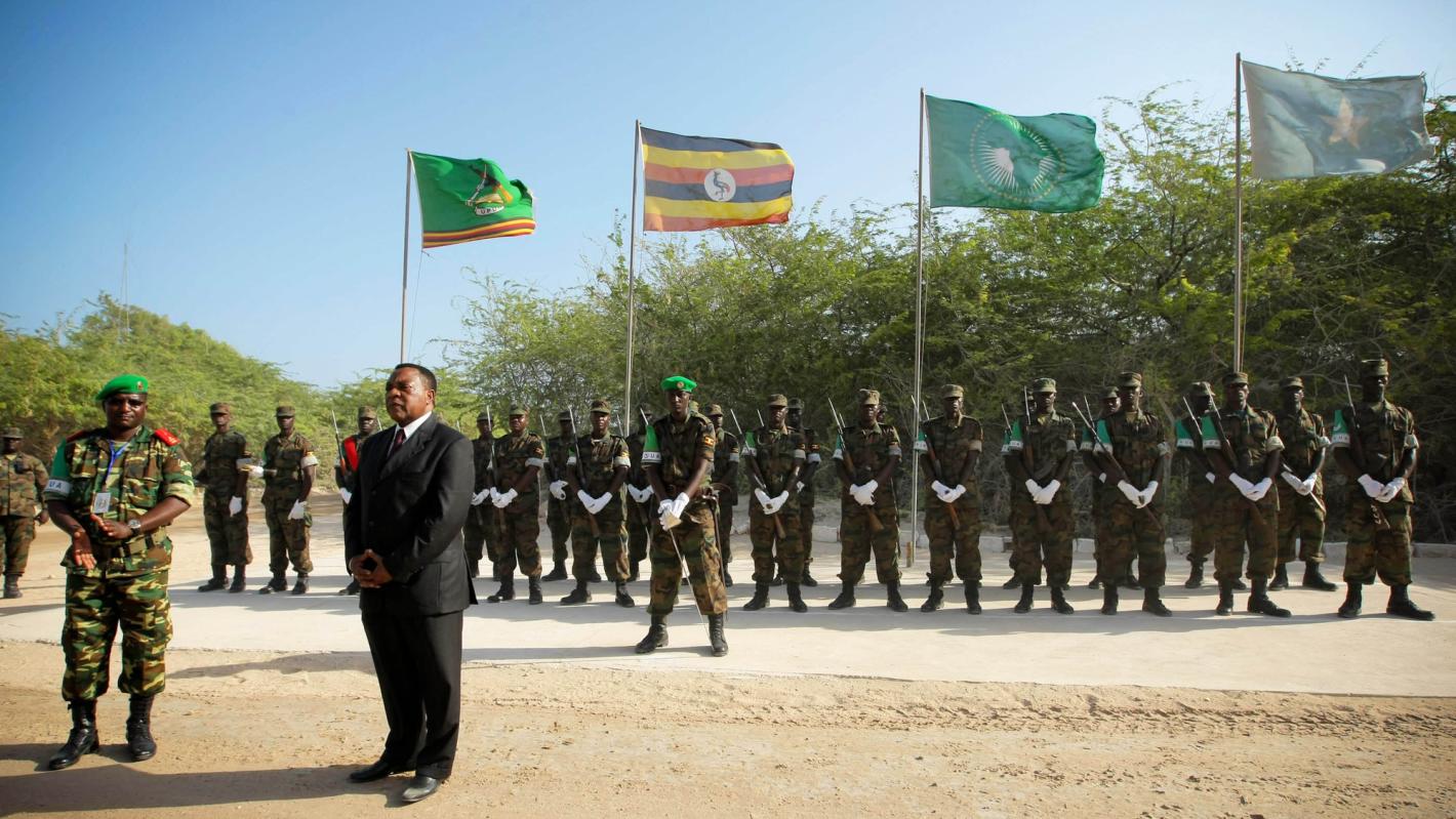 Augustine Mahiga (front, right), Special Representative of the Secretary-General and Head of the UN Political Office for Somalia (UNPOS), addresses troops and officers from the African Union Mission in Somalia (AMISOM) following his arrival in Mogadishu.