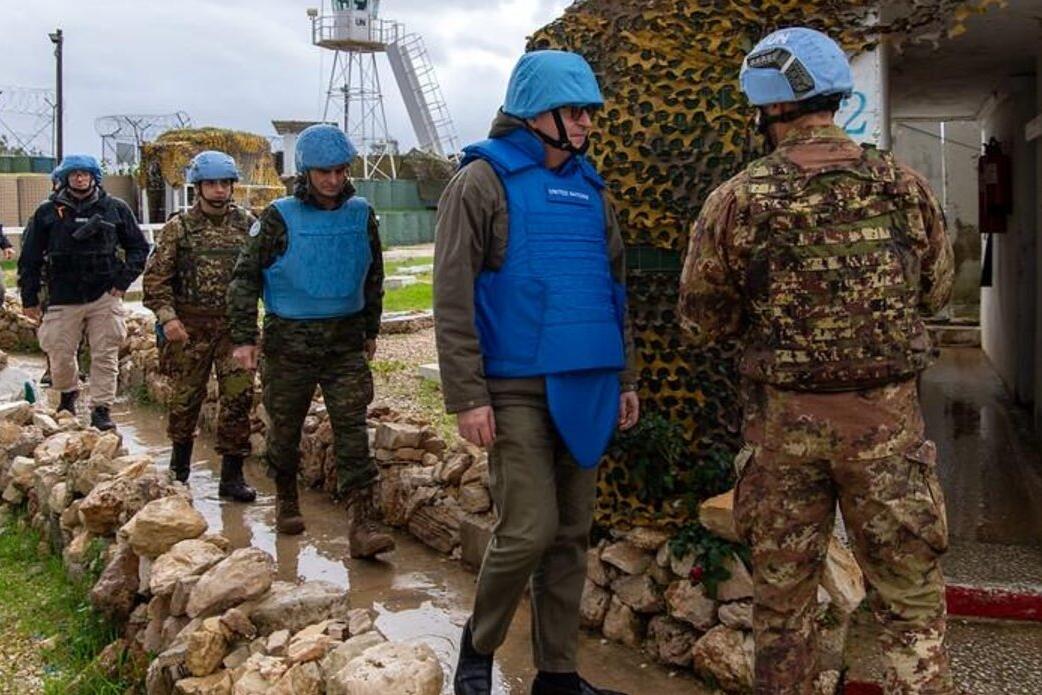 Jean-Pierre Lacroix and peacekeepers enter a site.